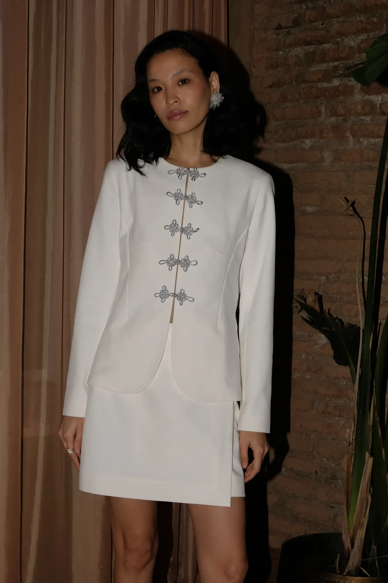 White two-piece with Asian-style fastening